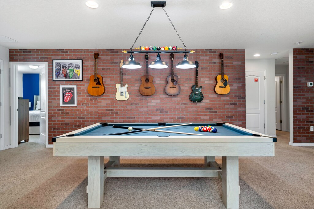 In need of more entertainment? Our second TV room features a pool table!