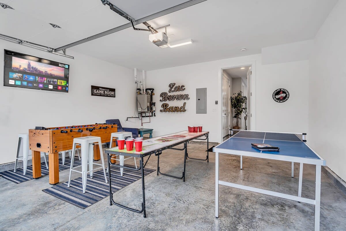 Challenge your crew to a foosball face-off or ping pong match in our Nashville game room, your perfect post-tour hangout in Music City. This space doubles as a mini-arena where laughter and competitiveness blend, surrounded by iconic decor and a stocked game table setup. Perfect for any Nashville getaway, whether it's a family vacation or a bachelorette celebration, this luxury vacation rental binds the group for unforgettable fun. 

Book your stay with Misfit Homes now!