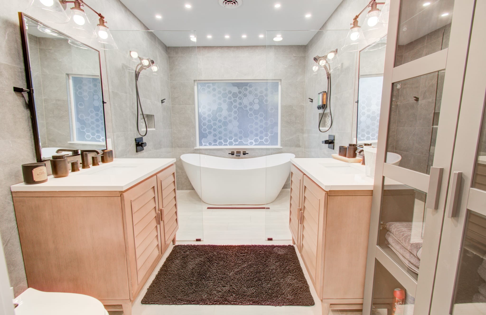 Go ahead and cancel your spa appointment. With a bathroom as nice as this one’s, you can get the spa experience right here in your home away from home!