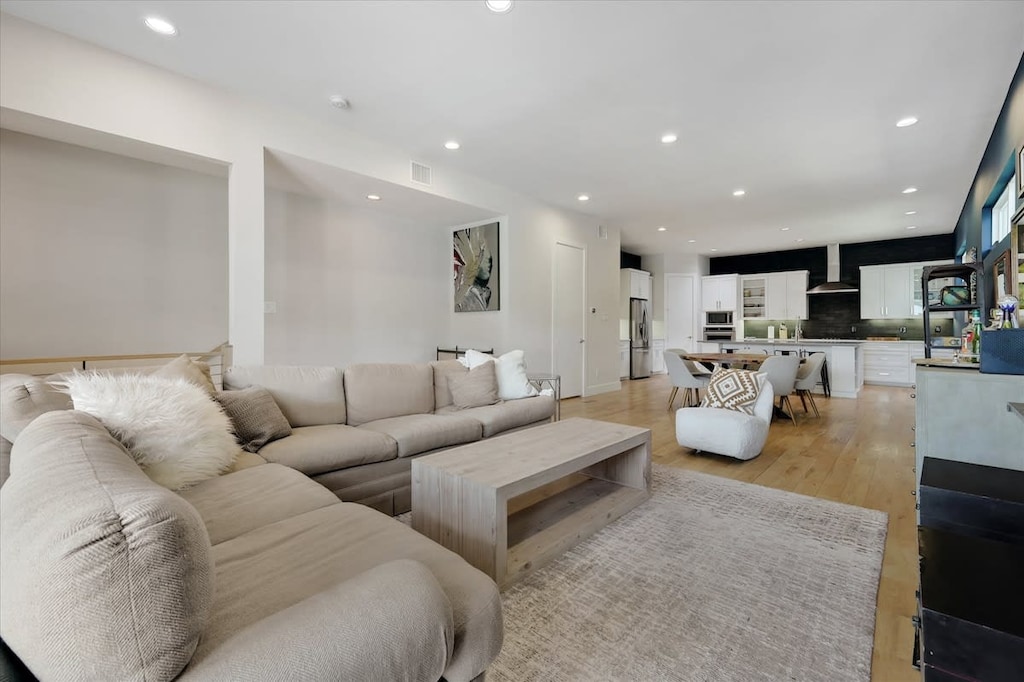 The plush oversized L-shaped couch offers the perfect place to unwind and relax with your loved ones as you catch up and enjoy your favorite movies on the HDTV.