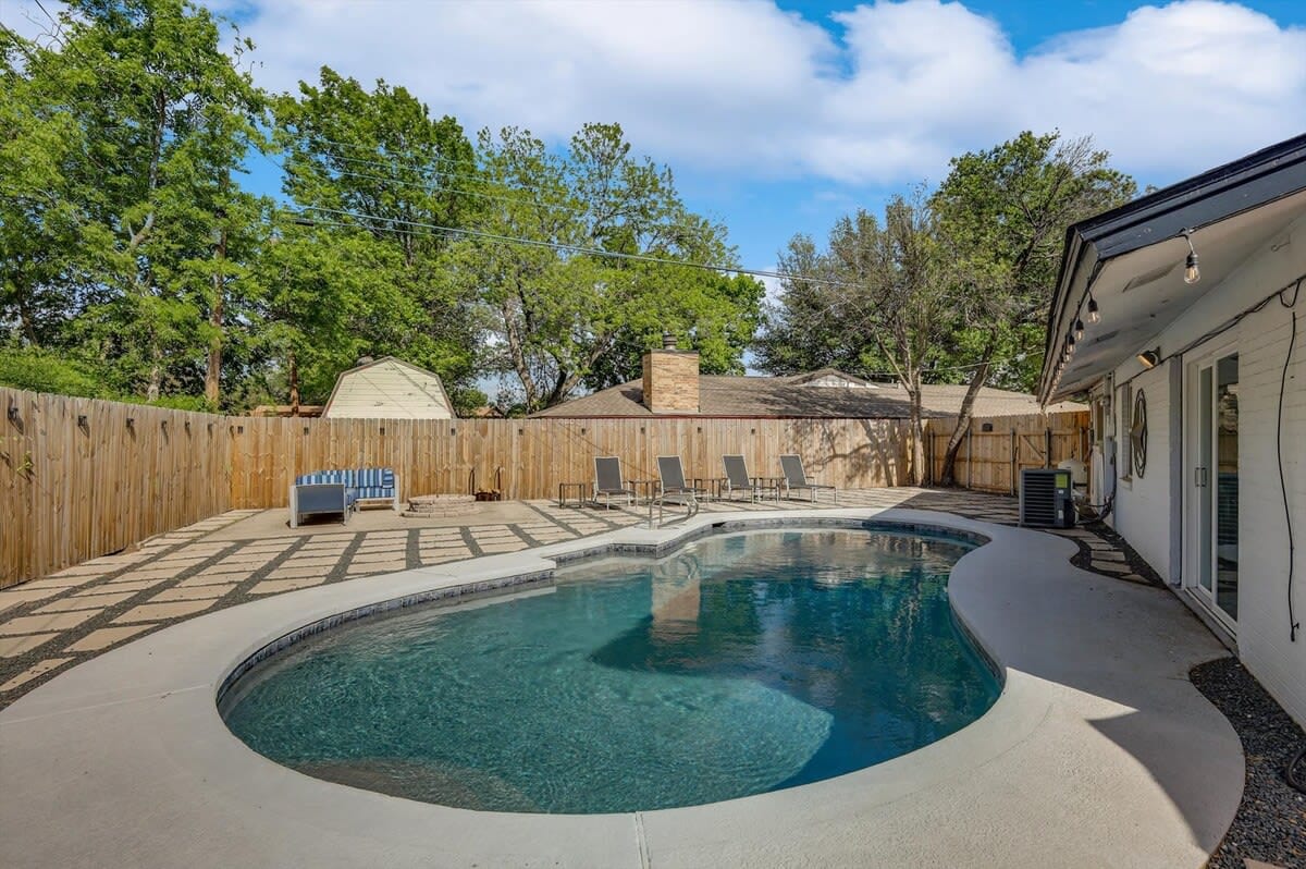 Nothing says vacation like a backyard pool oasis! Jump in and cool off on a hot day or work on your tan as you sunbathe in one of the poolside loungers.