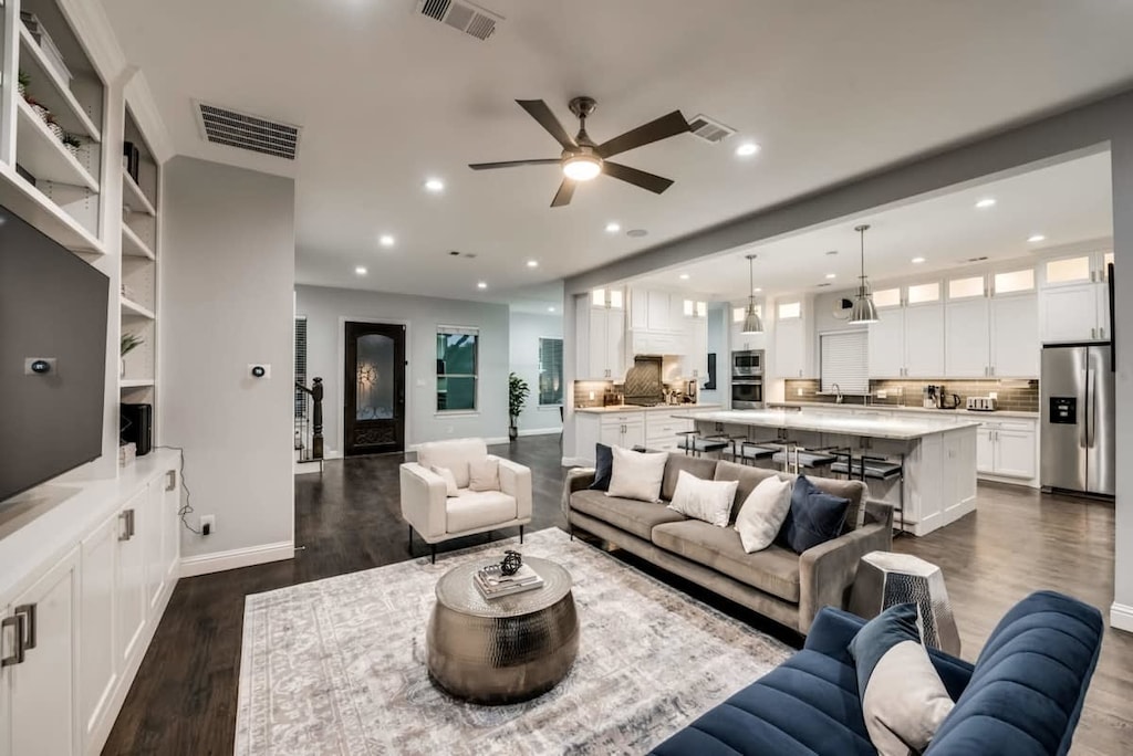 This living room might look like it walked off the set of an HGTV show but it’s yours to live in!