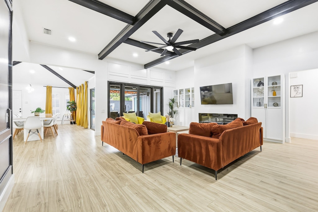 Airy and bright with plenty of natural sunlight, this living room features a modern sophisticated atmosphere that’s perfect for entertaining!