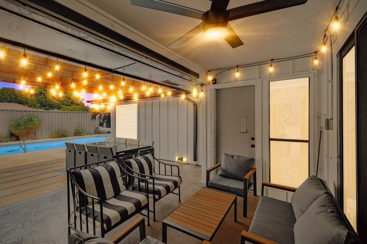 Decorated with glowing string lights to offer a warm ambiance, this covered patio is perfect for late night conversations and nightcaps.