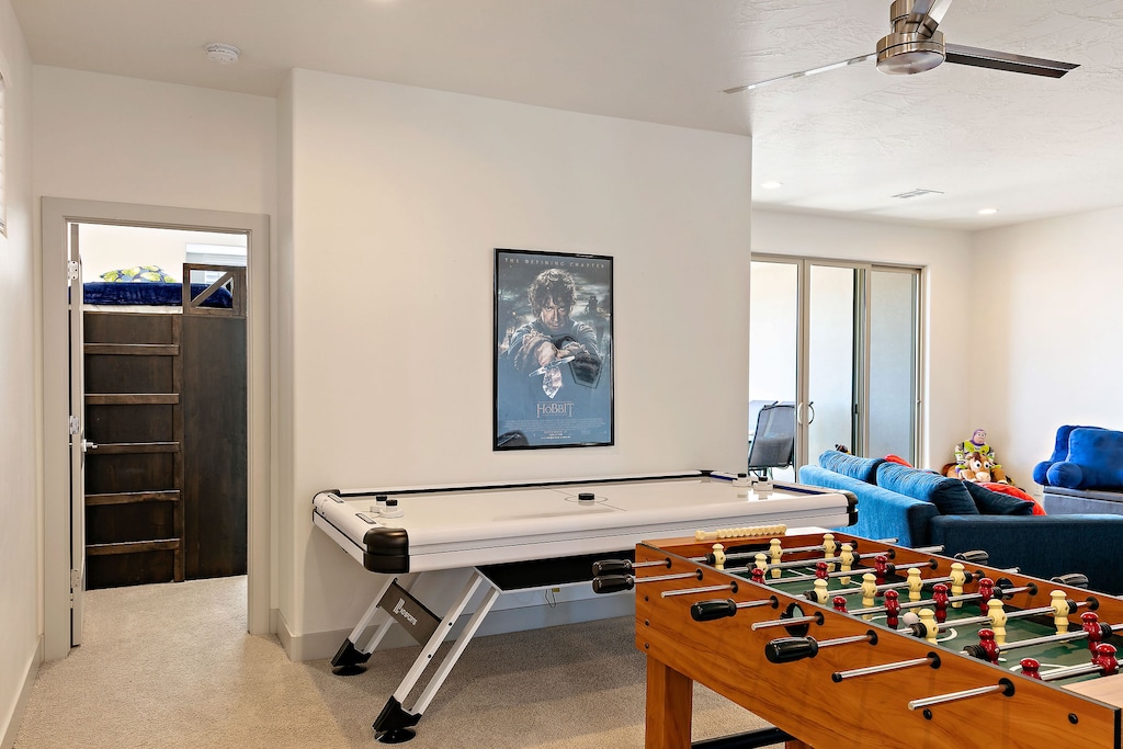 Upstairs game room with air hockey and foosball