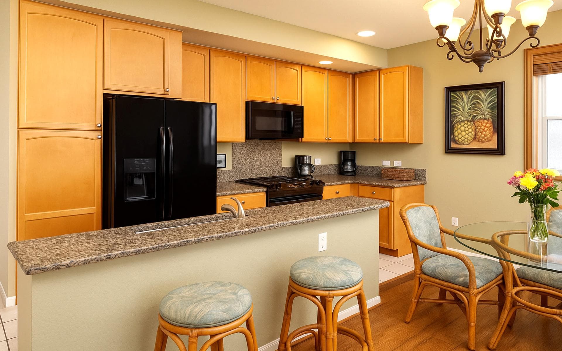 Enjoy morning coffee or evening wine at the bar of this beautiful granite kitchen