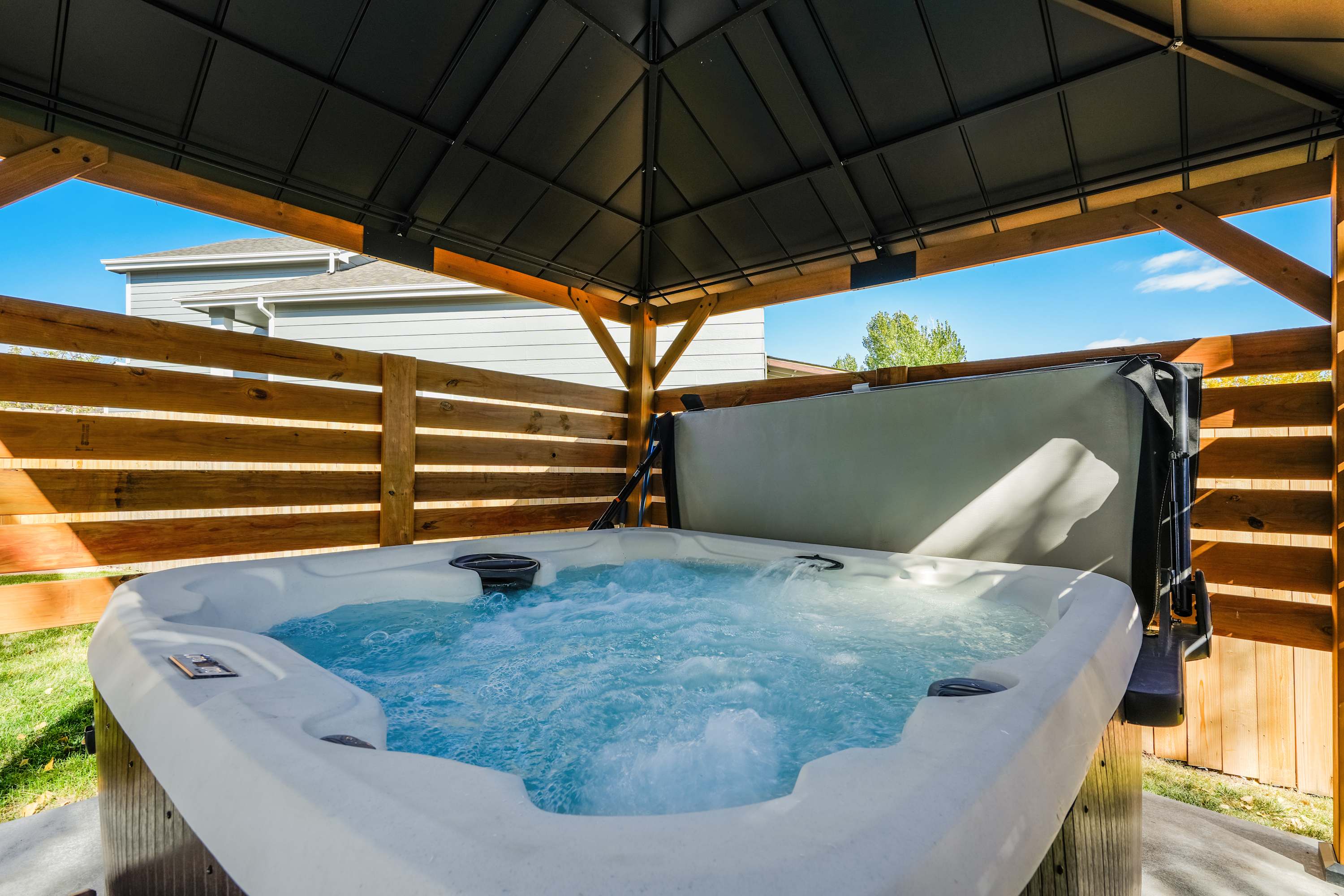 End your day in total relaxation with a soak in the private hot tub, tucked beneath a covered pergola for comfort and privacy. It’s the perfect way to recharge after mountain hikes or evenings spent around the fire pit. End your day in total relaxation with a soak in the private hot tub, tucked beneath a covered pergola for comfort and privacy. It’s the perfect way to recharge after mountain hikes or evenings spent around the fire pit.