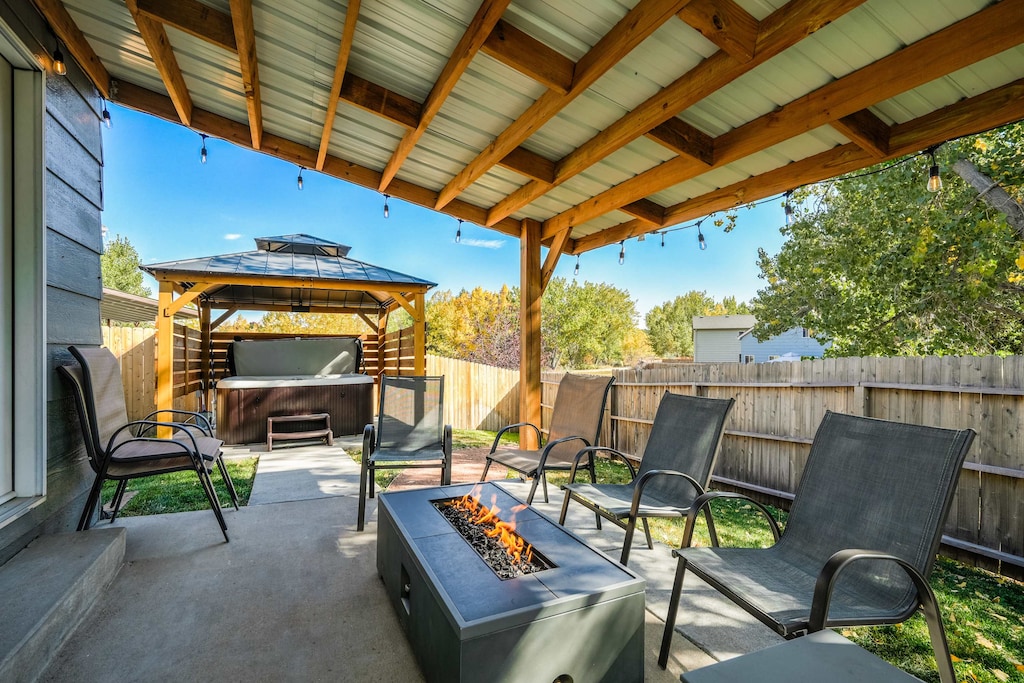 Welcome to Hearth Haven! The cozy living space, coupled with a spacious backyard featuring a hot tub & firepit, invites relaxation and outdoor activities. 