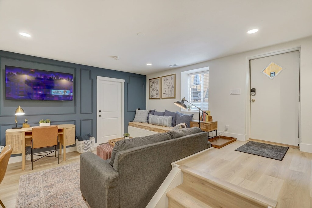 Cozy Corner for Every Mood! Our Living Area Boasts a Comfortable Couch, Smart TV, Lamps, and Tables. Read a Book or Enjoy Netflix - It's Your Relaxation Headquarters!