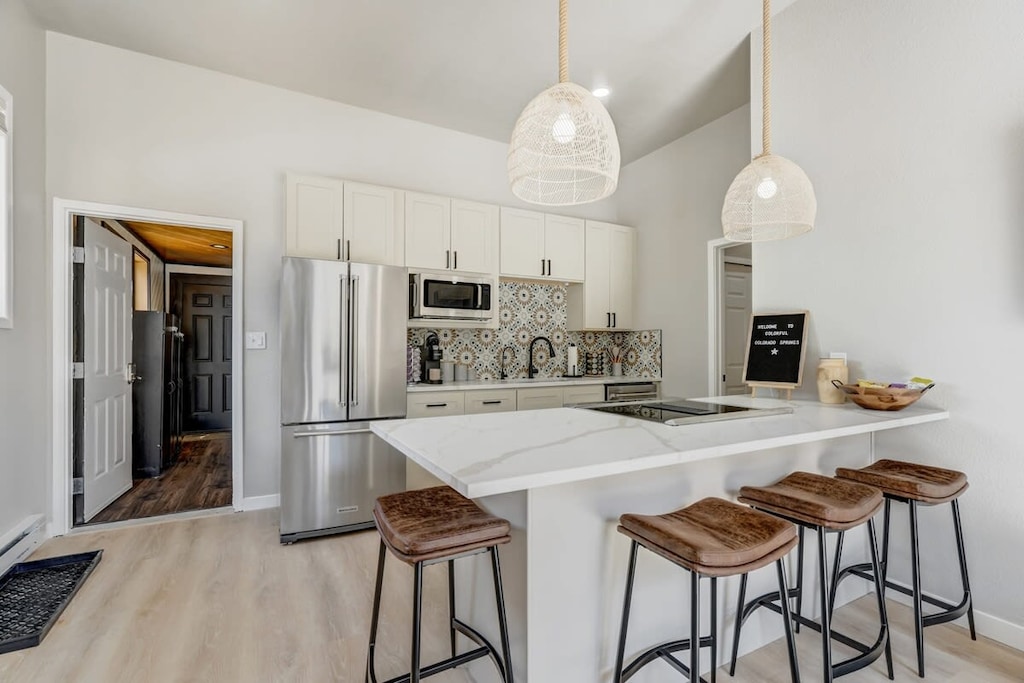 Your Culinary Haven! The Kitchen Showcases a Stove, Oven, Microwave, Toaster, Coffee Maker, and Dishwasher. Equipped with All the Tools You'll Need for Your Stay