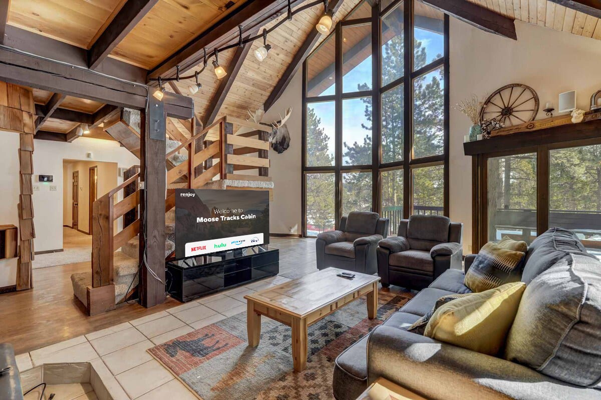 Enter the realm of relaxation, where the moose watches over your Netflix binges and the window whispers tales of the majestic pines. It's like having your own personal theater with a touch of wildlife!