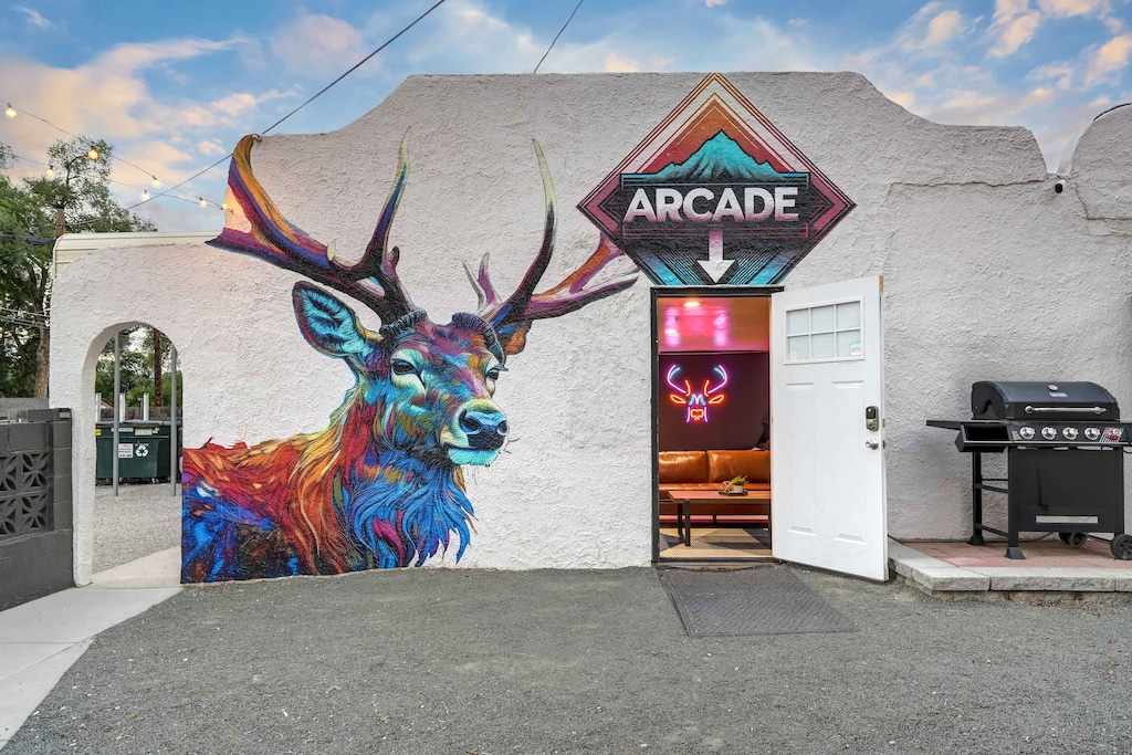 Step into fun with our vibrant arcade room, perfect for all ages to enjoy classic games in a unique western-themed setting!