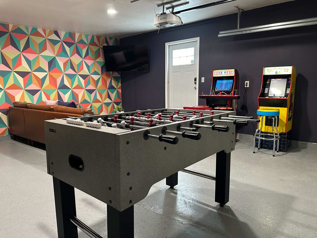 Enjoy hours of entertainment in the vibrant game room, featuring foosball, arcade classics, and a TV for all-around fun!