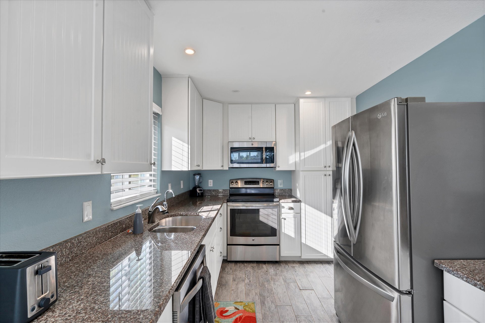 Fully-equipped kitchen with stainless-steel applainces and lots of countertop space