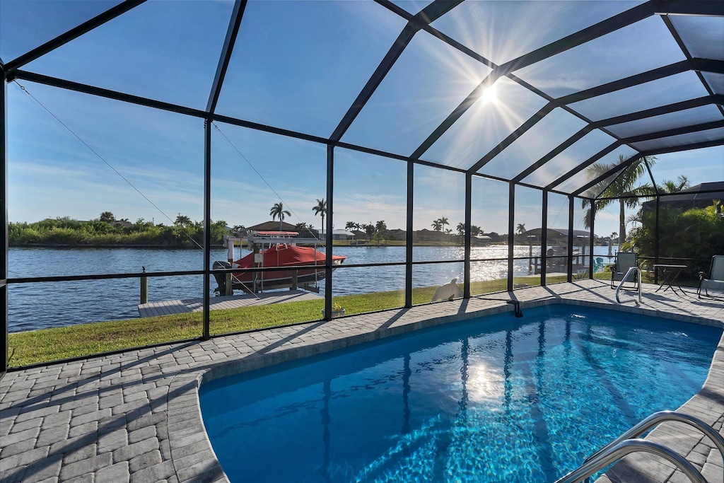 Lovely South Gulf home with sparling pool overlooking canal (Boat lift not available)