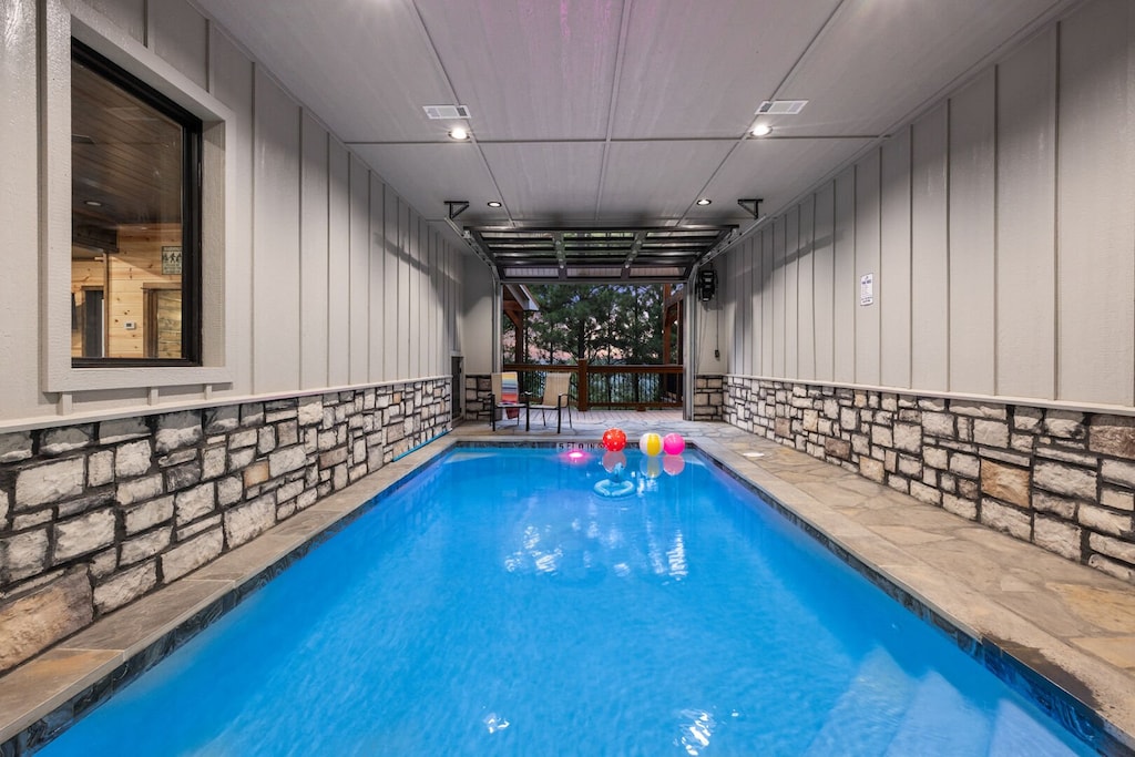 Indoor swimming pool with garage door