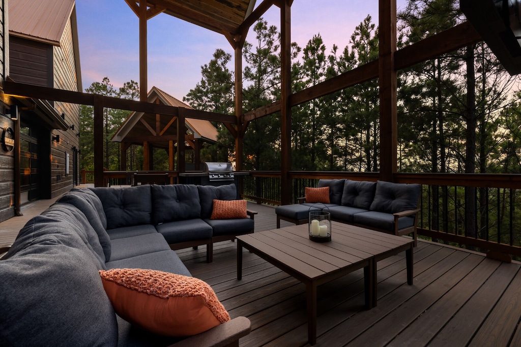 Plenty of comfy seating outside by the fireplace