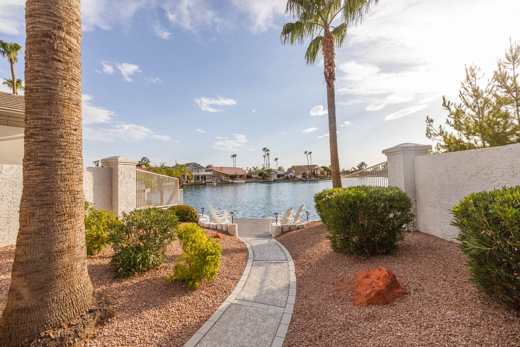 A stone pathway leads to a lake in our backyard