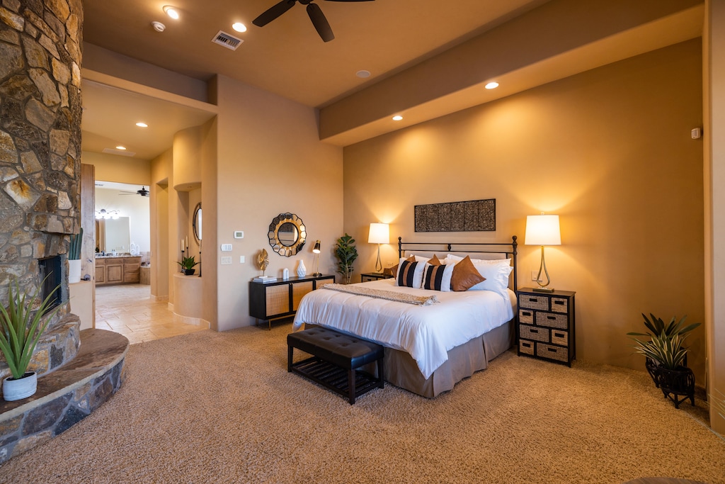 A true master bedroom retreat w/ en-suite bathroom, TV, fireplace and seating area!