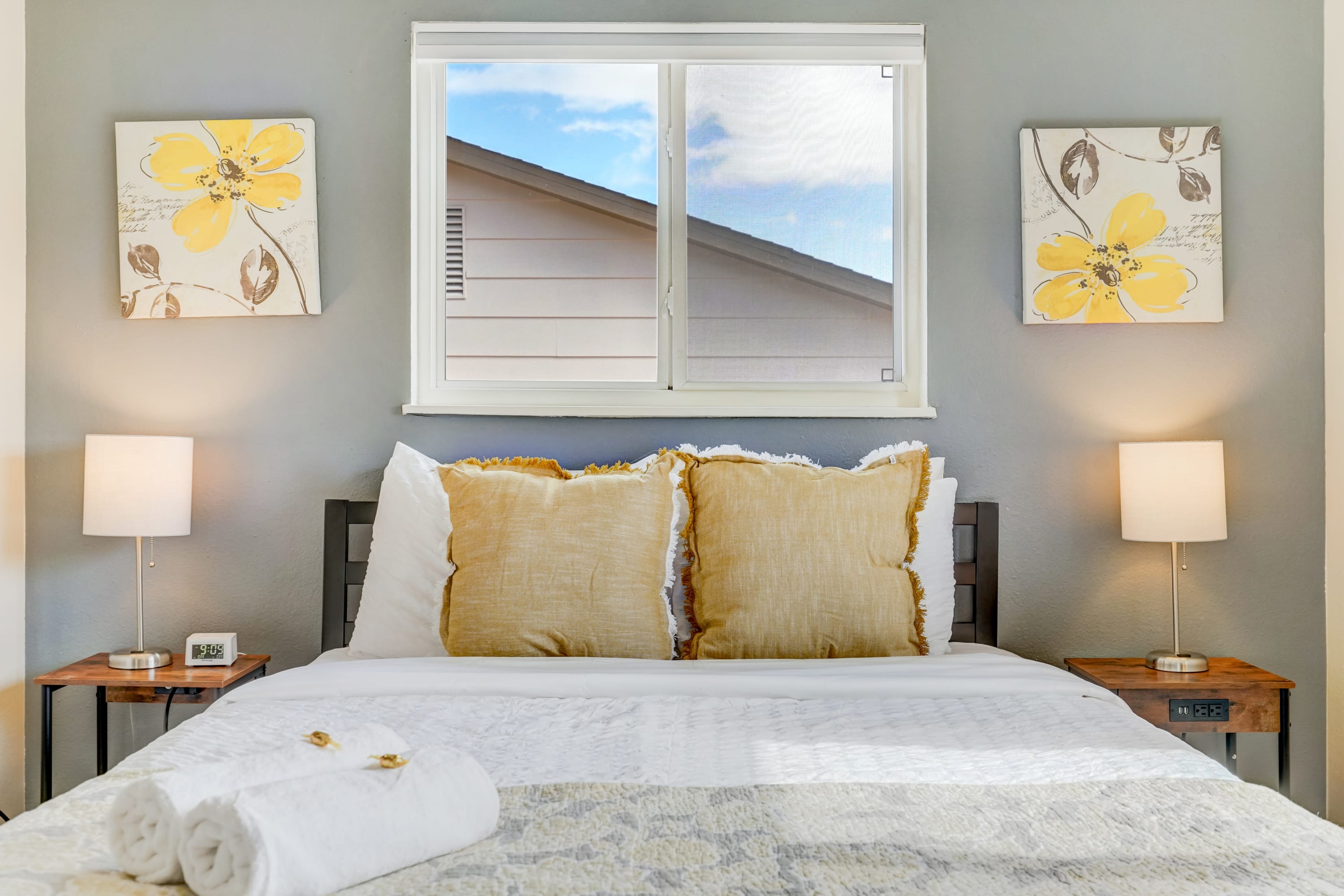 Relax and unwind in this cozy, light-filled bedroom at Quarry Peak, featuring a comfortable bed with soft pillows, stylish decor, and a calming ambiance perfect for restful nights.