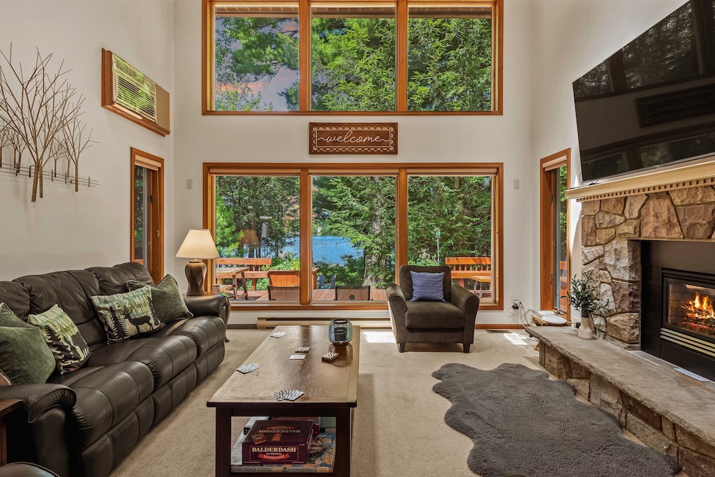 Lake views through floor-to-ceiling windows in the living room.