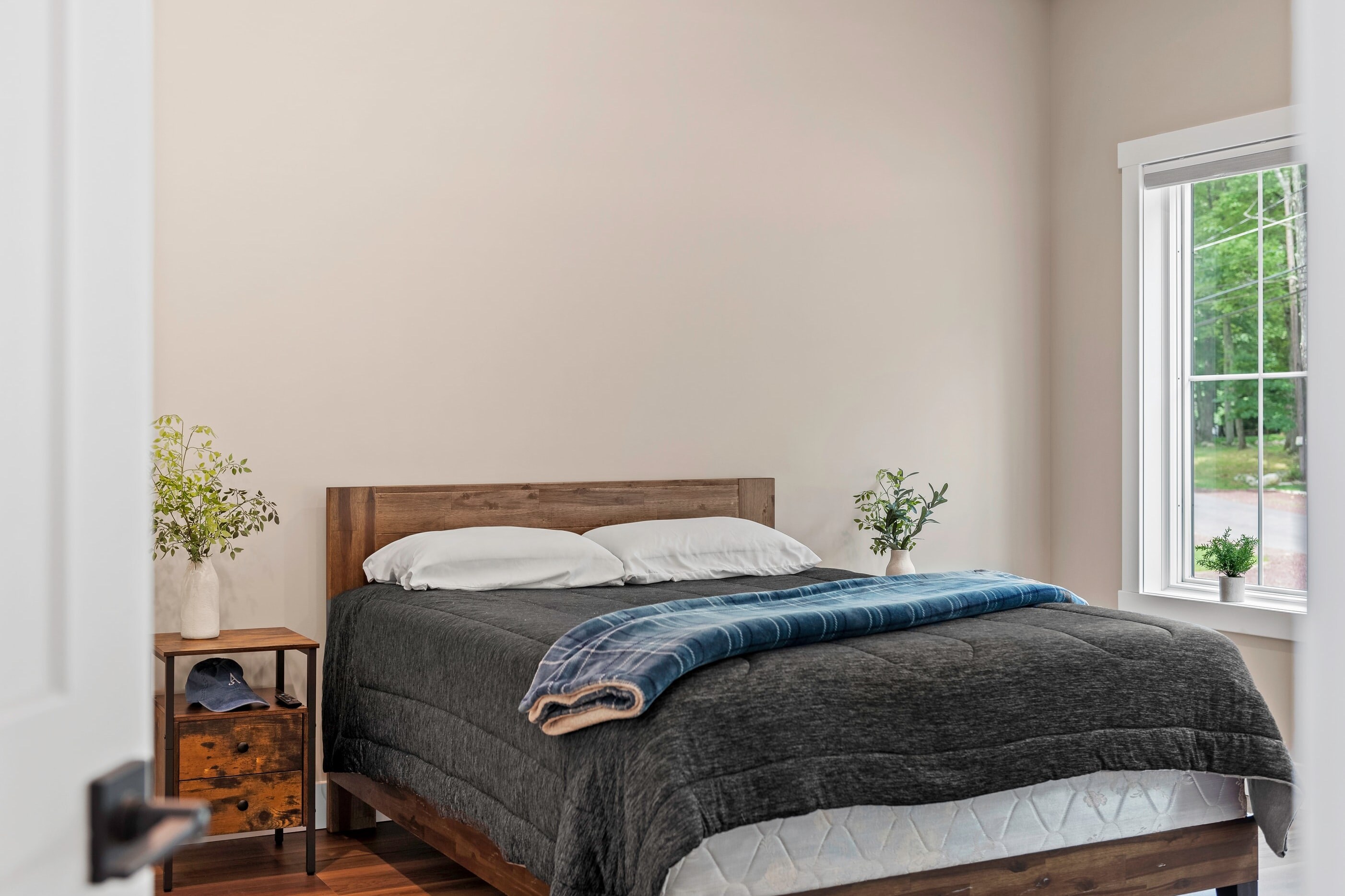 Bedroom 2 features a queen bed and TV.