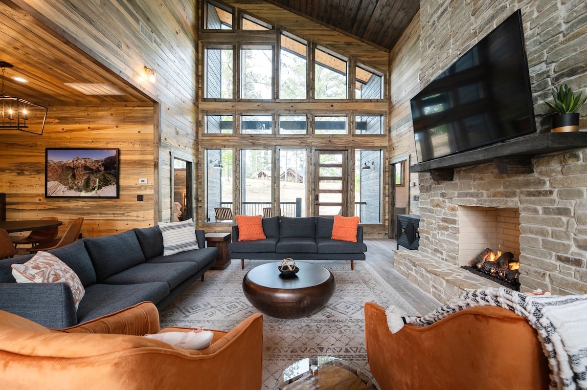 Spacious living room on the main floor with floor-to-ceiling windows