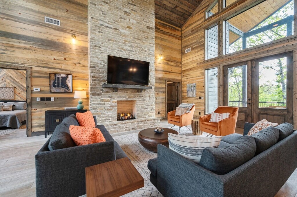 Spacious living room on the main floor with floor-to-ceiling windows