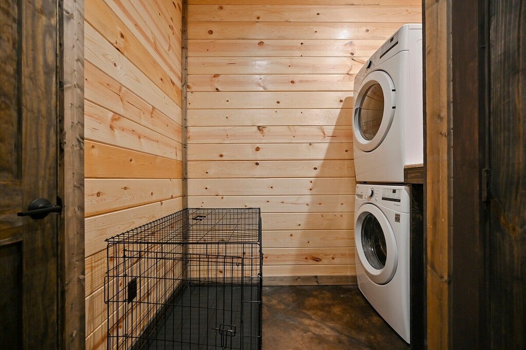 Laundry closet with large dog crate provided