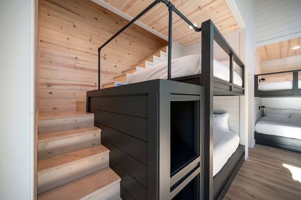 Hidden staircase in bunk room leading to hidden game room