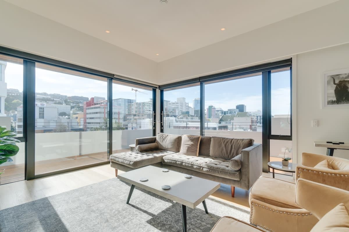 Spacious open-plan living area featuring large glass doors opening onto your own private, wrap-around terrace