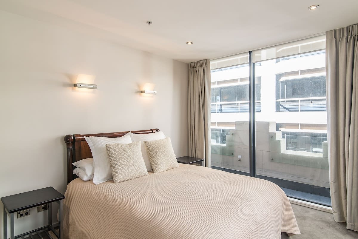 Master bedroom with floor to ceiling windows and lots of natural light (a single bed is also located in this room - not shown in photo)