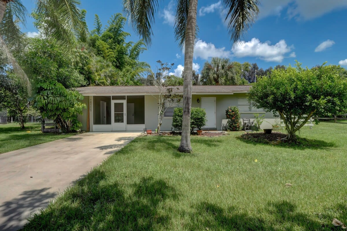 Our Home Is Located on a 1/2 Acre Lot With Tons of Privacy and Large Trees