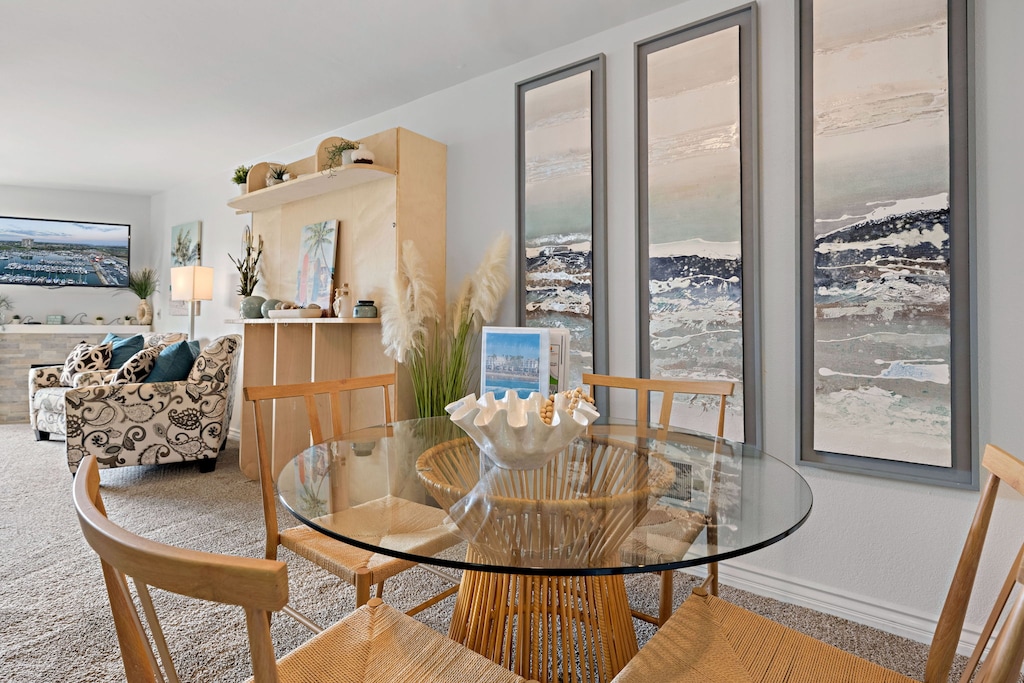 The dining area has a table with seating for 4