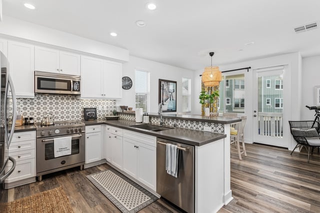 Gather around for a delicious meal in this open-concept dining space.