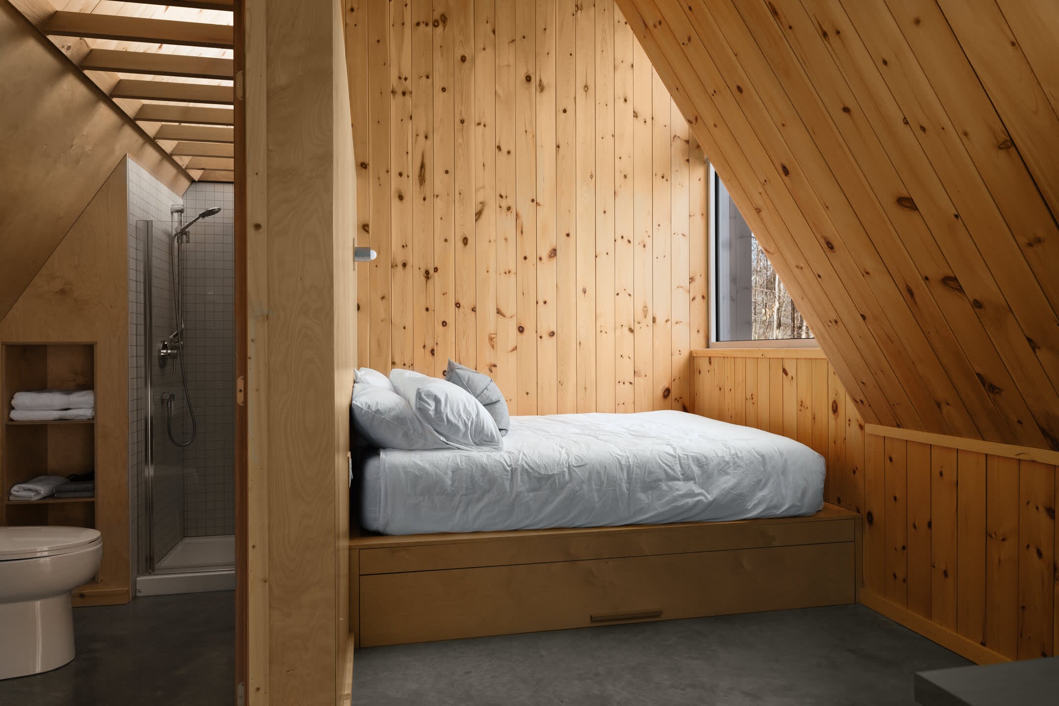 Drift off surrounded by warm timber, your private bath steps away.