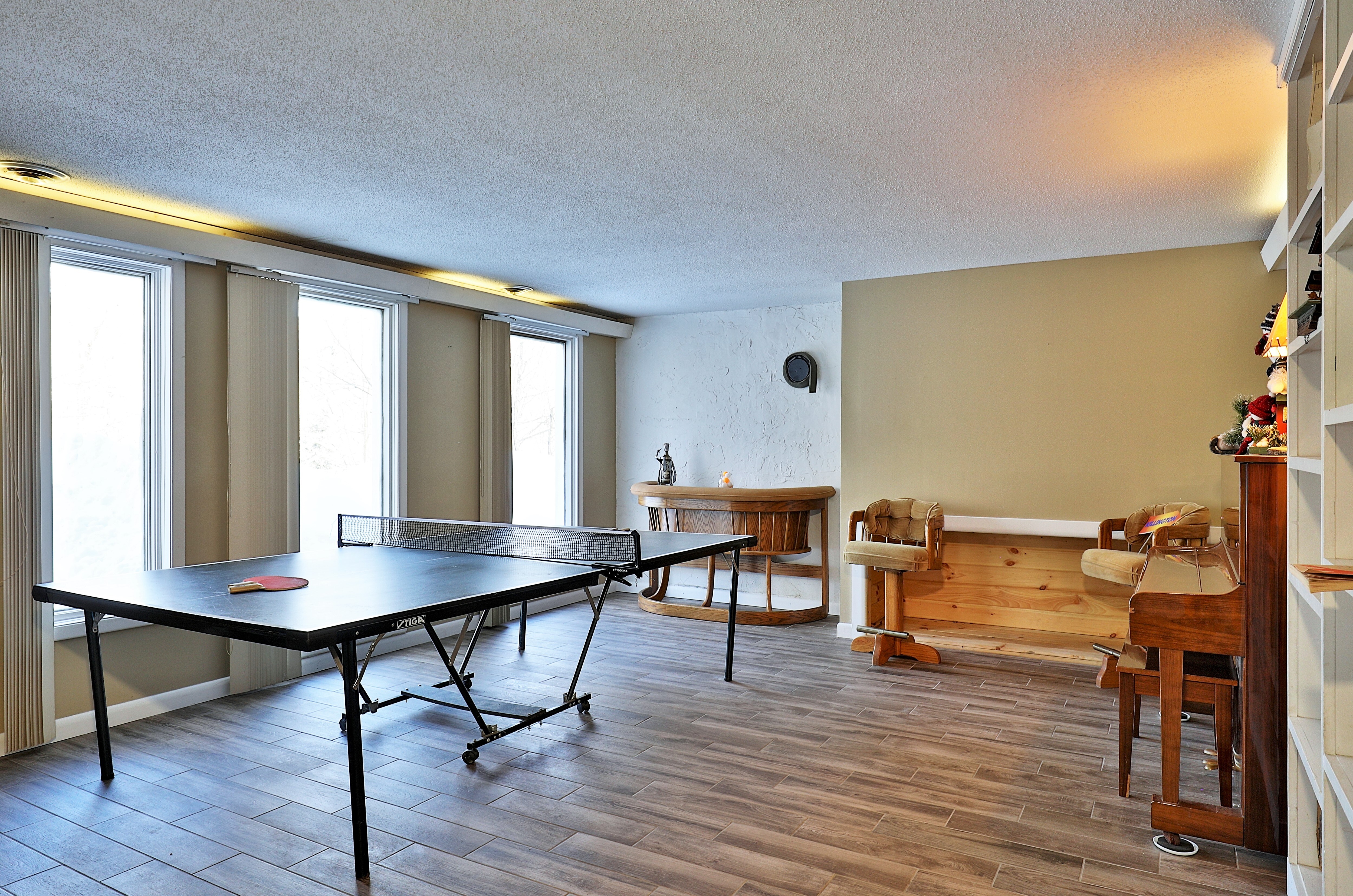 Enjoy playing ping pong in the lower level of the home