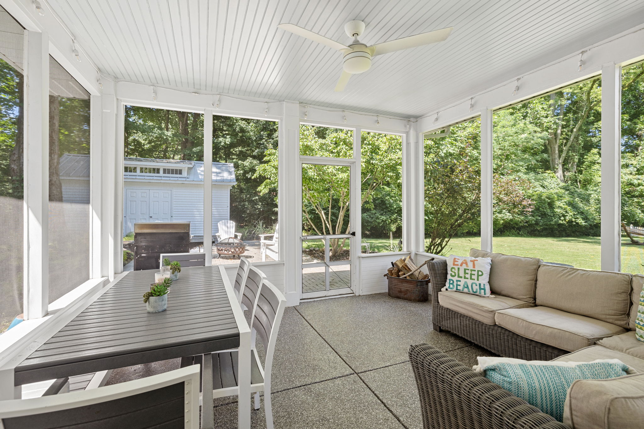 Dine, relax, and soak in the serenity—this porch is your year-round retreat.