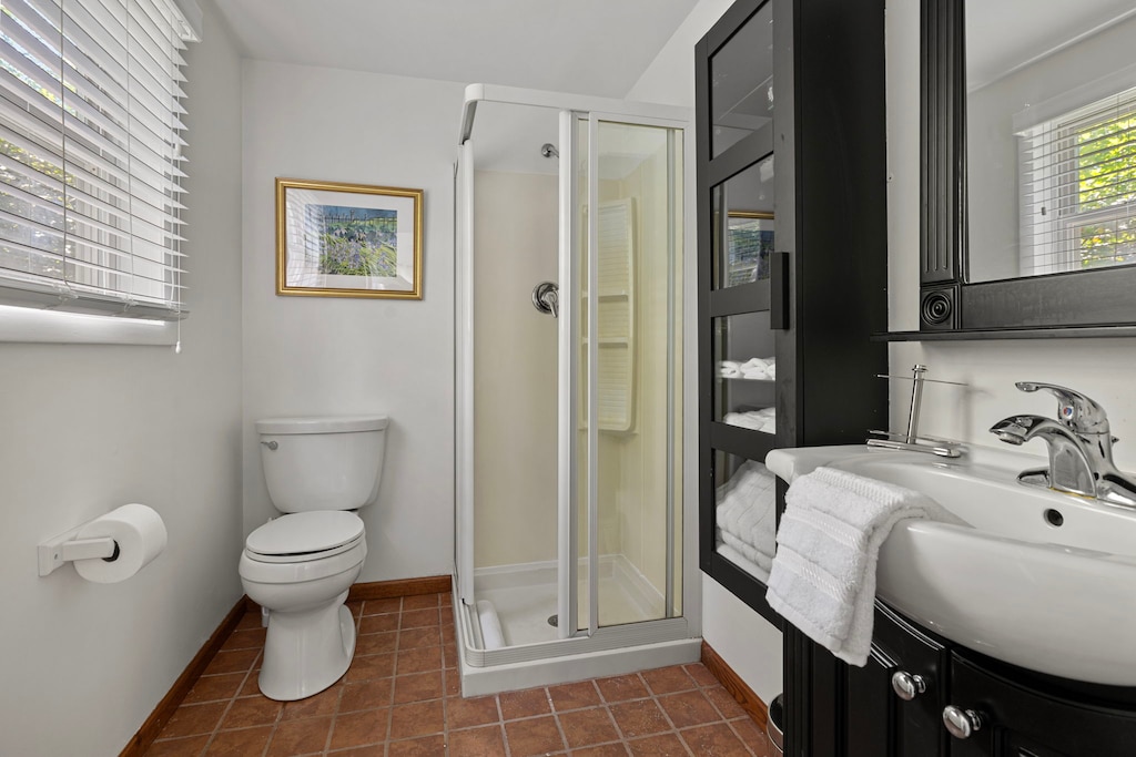 Compact and chic—this bathroom packs in all the essentials with style and light to spare.