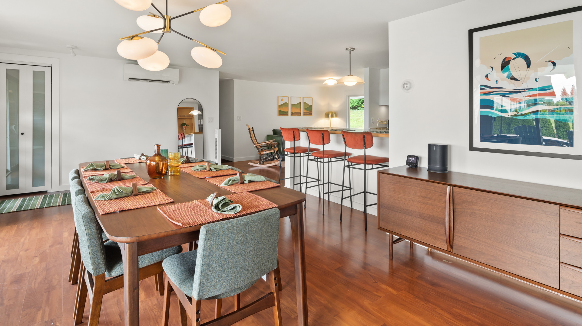 Enjoy a family meal together around the dining room table with extra seating at the breakfast bar