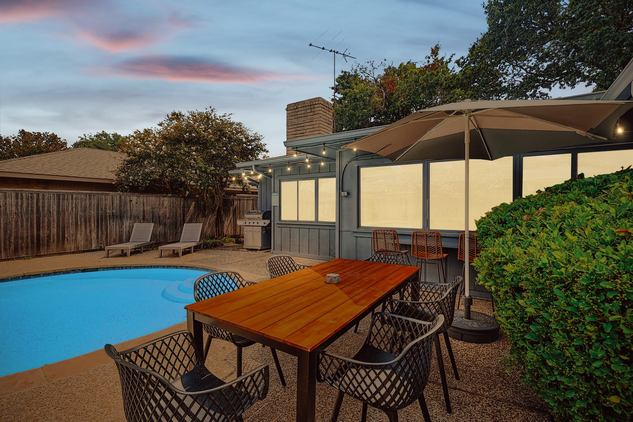 There’s something for everyone in this backyard pool oasis, whether you’re looking for some fun in the sun, al fresco patio dining, or simply relaxing on a poolside lounger.