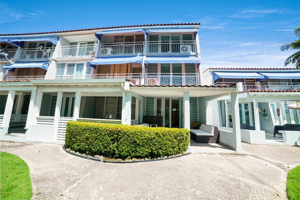 This 3-story, ground–entry–spacious Villa in the gated community of Villas Playa 2, boasting a lovely community pool and clubhouse on the property