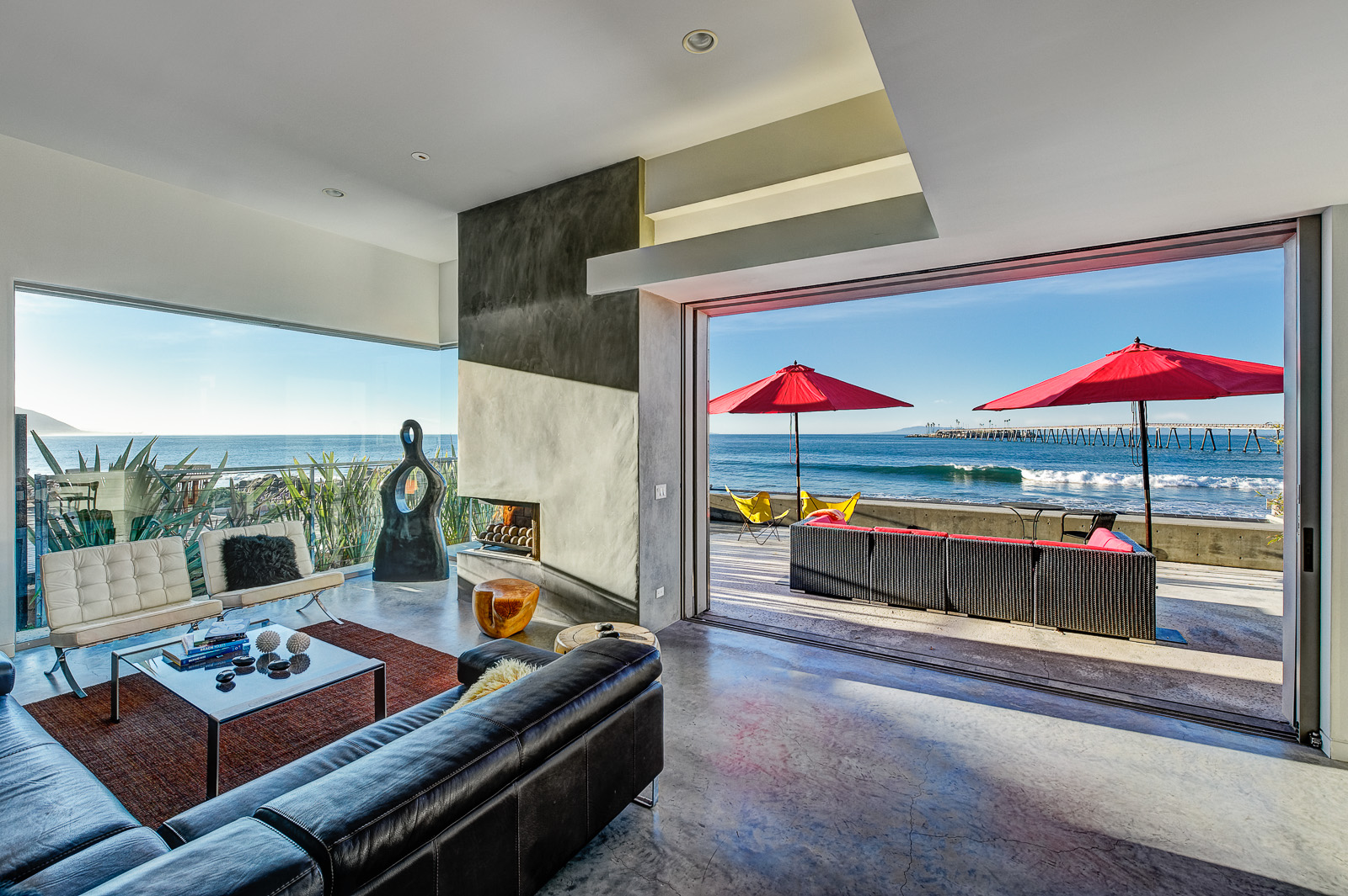 Living Room with panoramic ocean views~ a fireplace~ and a TV.