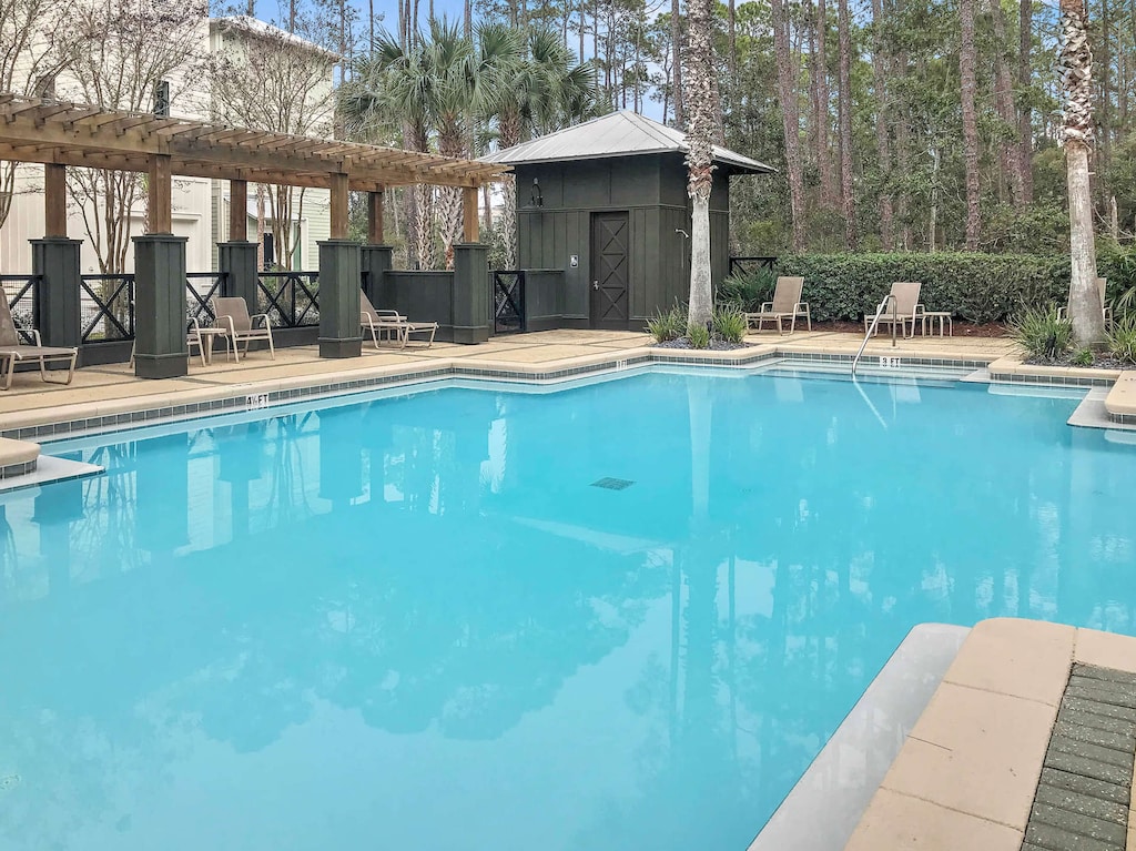 The community pool is footsteps from the home
