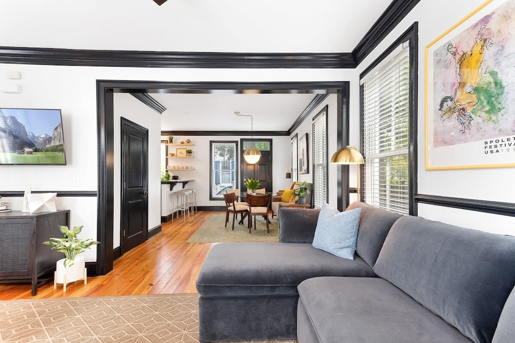 Inviting,  bright, open layout living room space with a sleeper sofa