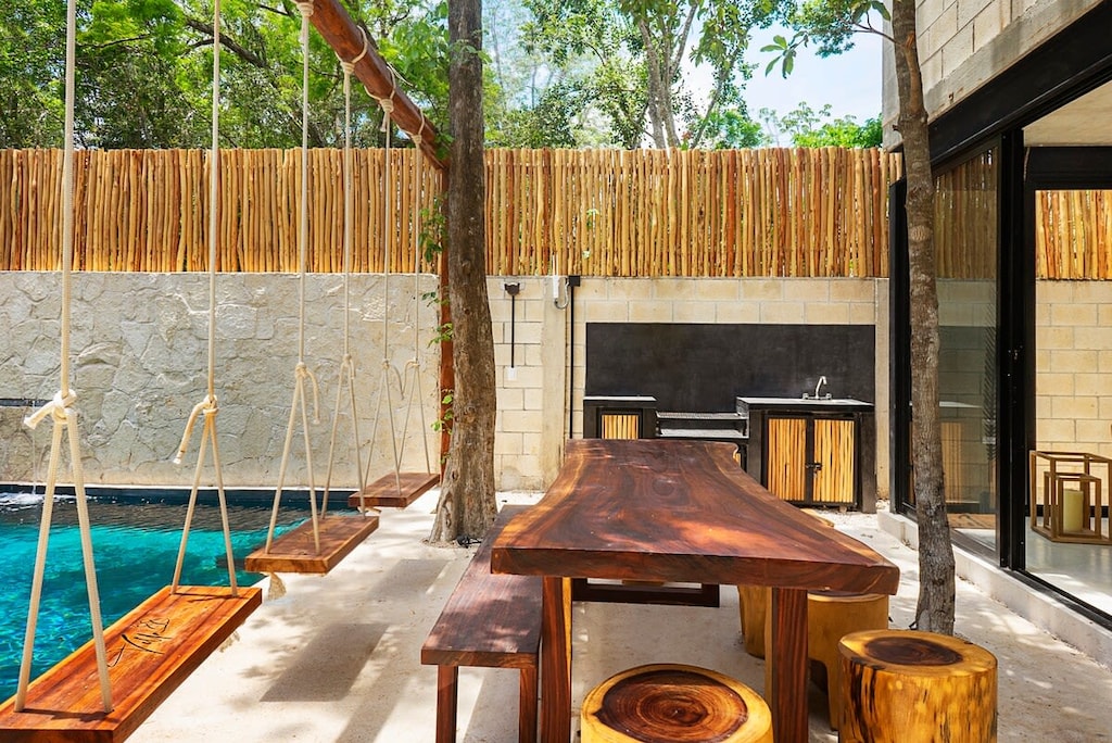 Outdoor table with swings