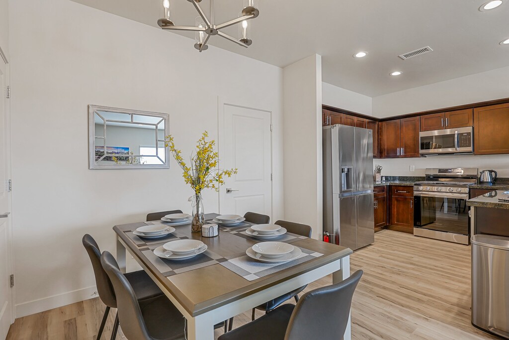 With seating for six, the dining table has plenty of space for the whole group to dine together.