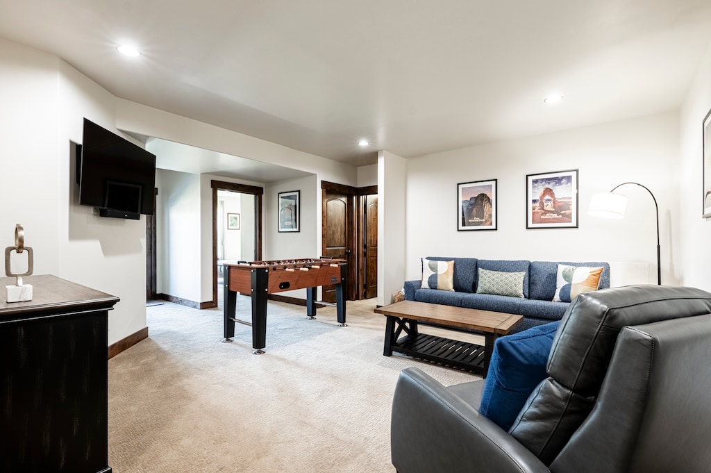 Lower level family room with a foosball table