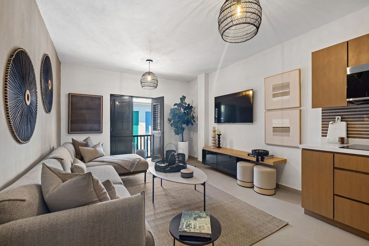 Living room with AC and flat screen TV