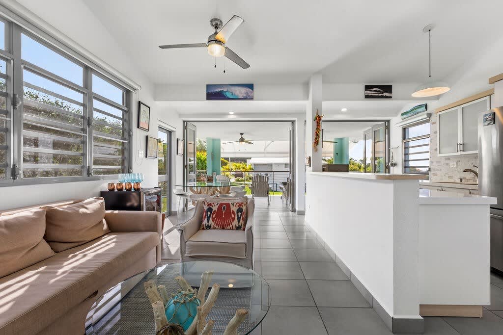 The living area is an open concept space where the kitchen, living room and dining seamlessly connects to the outdoor balcony.